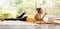 Healthy Asian woman lying on the floor eating salad looking relaxed and comfortable