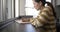 Healthy Asian Woman takes notes in a beautiful Office