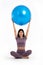 Healthy Asian woman workout with fitball by raising the ball over the head on isolated white background, Concept of good health