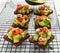 Healthy Avocado and cherry tomato rye sourdough toasts with pumpkin, sesame and nigella seeds, drizzled with olive oil