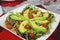 Healthy avocado dish, cherry tomatoes, almond lettuce and for romantic dinner