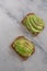 Healthy avocado toast. Mashed avocado on whole grain rye bread