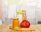 Healthy baby food: milk, juice, puree, apple on background kitchen.