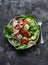 Healthy balanced diet food - canned tuna, tomatoes, cucumbers, romaine salad, red onion, olive oil salad dressing appetizer, lunch