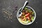 A healthy, balanced, healthy diet. Meat balls, tomatoes, rice, cucumbers, soy beans, spinach, lemon, bowl. Top View.