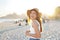 Healthy beautiful young woman smiling on Ipanema beach. Delightful laughing girl enjoying sunset in Rio de Janeiro, Brazil