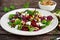 Healthy Beet Salad with fresh sweet baby spinach, kale lettuce, nuts, feta cheese and toast melted