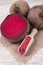 Healthy beetroot juice and fresh vegetables on wooden background.