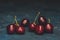 Healthy berry. Fresh group large cherries on a dark background. Closeup