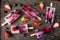 Healthy berry fruit popsicles, flat lay on a dark background