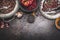 Healthy Black beluga lentil salad preparation with pomegranate on dark rustic background, top view
