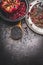 Healthy Black beluga lentil seeds cooking on dark rustic background, top view