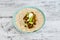 Healthy blant-based recipes, beans rice and avocado open wrap with vegan aioli