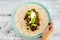 Healthy blant-based recipes, beans rice and avocado open wrap with vegan aioli