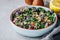 Healthy bowl kale and quinoa salad with cranberry, red onions and almonds