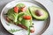Healthy breakfast with avocado and Delicious wholewheat toast. sliced avocado on toast bread with spices. Mexican cuisine