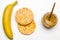 healthy breakfast, banana, two rice breads and peanut butter, white background