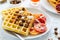 Healthy breakfast. Belgian waffles with nuts and sicilian oranges