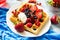 Healthy breakfast: Belgian waffles with sour cream, strawberry, raspberry, blueberry, cherry and red currant