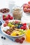 Healthy breakfast - berries, fresh fruit and cereal on the plate