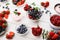 Healthy breakfast with berries and yogurt on white wooden table