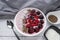 Healthy breakfast berry smoothie bowl topped with Blueberries, blackberries, chia seeds, raspberry and grounded coconut flakes.