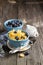 Healthy breakfast. Blue portioned ceramic bowls with corn flakes fresh blueberries