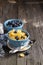 Healthy breakfast. Blue portioned ceramic bowls with corn flakes fresh blueberries