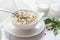 Healthy breakfast with boiled job`s tears porridge in white bowl