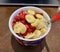Healthy Breakfast Bowl with Banana, Strawberry, Currant, and Oatmeal