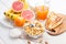 Healthy breakfast. bowl of cornflakes, fruit, fresh juice, milk