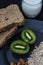 Healthy breakfast with bread, oatmeal, kiwi and milk for athletes