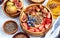 Healthy breakfast and breakfast ingredients, oatmeal with fruits and berries, figs, blueberries, strawberries, flax and chia seeds