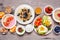 Healthy breakfast or brunch table scene on a wood background. Above view.