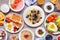 Healthy breakfast or brunch table scene on a wood background. Above view.