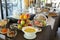 Healthy breakfast buffet table of fruit salad, various fruits, dried fruits, yoghurts during summer vacation in greek hotel