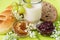 Healthy breakfast with bun, bread, honey, jam, glass of fermented milk and tiny flowers