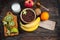 Healthy breakfast - cereal chocolate balls, milk and fruit on wood background