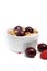 Healthy Breakfast with Cereals, Yogurt, Cherries and Raspberries in White Bowl