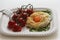 Healthy breakfast with cloud egg ,spinash and cherry tomatoe . Clouds is an oven dish, when the egg white and egg yolks