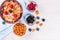 Healthy breakfast, coffee cornflakes berries and milk, with text space top view close-up