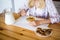 healthy breakfast concept - woman in pajamas eating in the kitchen