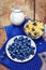 Healthy breakfast with corn flakes, berries (blueberry), milk on