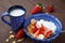 Healthy breakfast. Cornflakes, fresh strawberries, banana, yogurt and milk