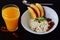 Healthy breakfast: cottage cheese with flax seeds, raisins, fresh apples and a glass of fresh orange juice. Healthy