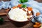 Healthy breakfast cottage cheese with raisins, dried apricots, almond, cashew and mint