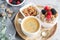 Healthy Breakfast Cup of Coffee Greek Yogurt with Homemade Granola, Berries, Raspberries and Blackberries Work Laptop