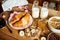 Healthy breakfast with different types of breakfast cereal with honey marmalade croissants and milk