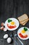 Healthy breakfast: fried egg on wooden table and three slices of bread with greens, eggs, tomatoes and pepper