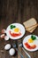 Healthy breakfast: fried egg on wooden table and three slices of bread with greens, eggs, tomatoes and pepper